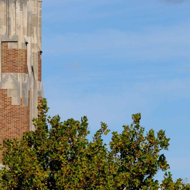Image of the top of Beaumont Tower set against a blue sky.